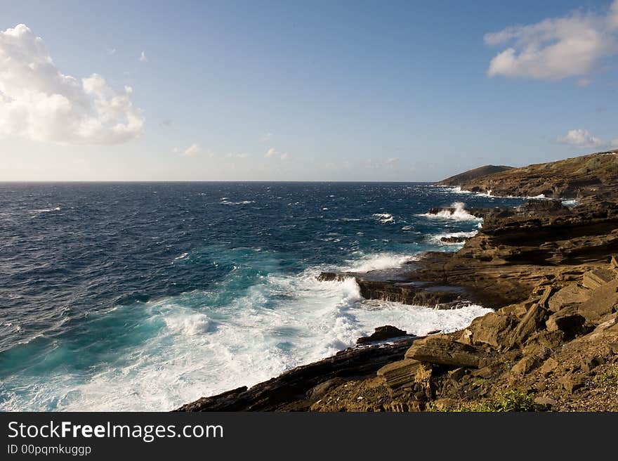 Rough seas slamming against a rocky shoreline