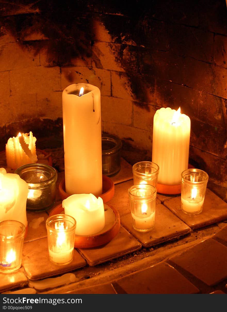 Candles burning inside of a southwest kiva fireplace. Candles burning inside of a southwest kiva fireplace.