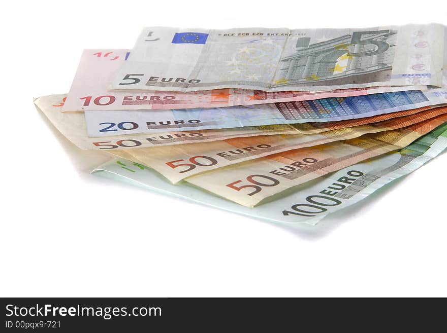 An isolated shot of Euro banknotes in all sizes. A lot of white space for text. An isolated shot of Euro banknotes in all sizes. A lot of white space for text.