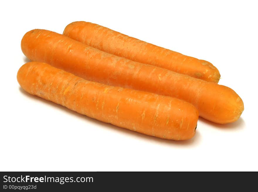 Three carrots on a white background