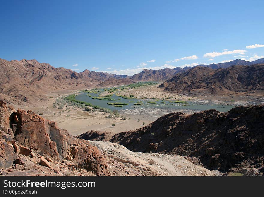 View of the Orange River in Namibia from a nearby mountain. View of the Orange River in Namibia from a nearby mountain