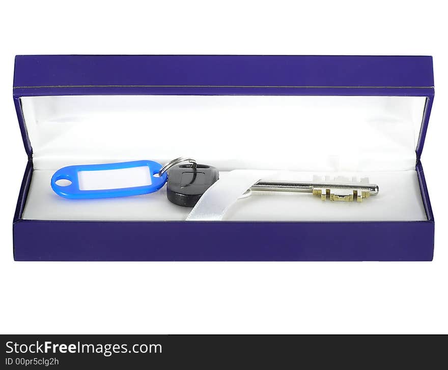 Key in a gift box isolated on a white background