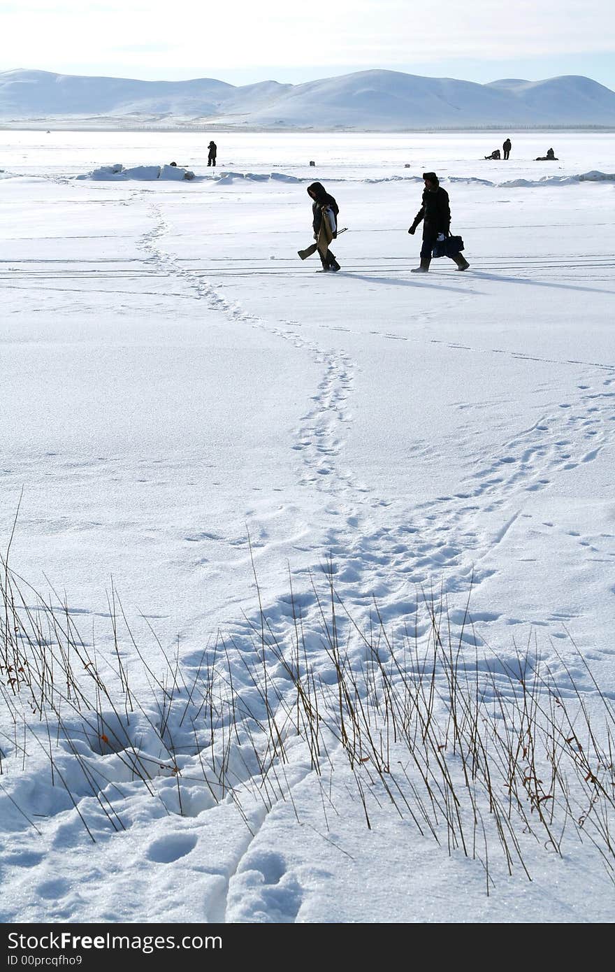 Winter Arctic landscape with fishermen. Winter Arctic landscape with fishermen