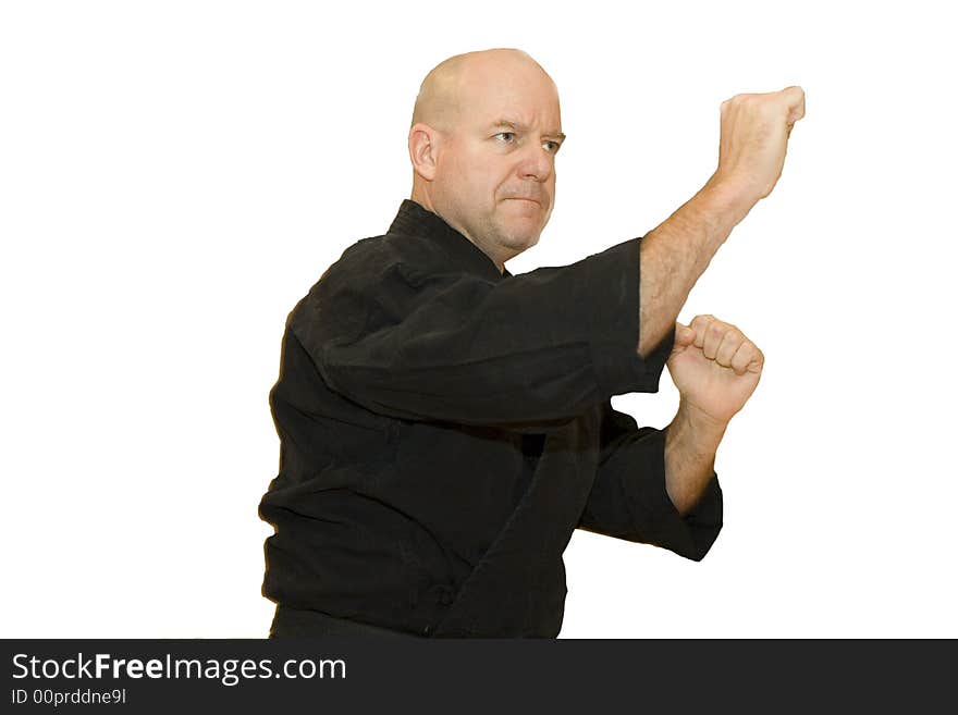 A black belt martial artist in a fighting stance