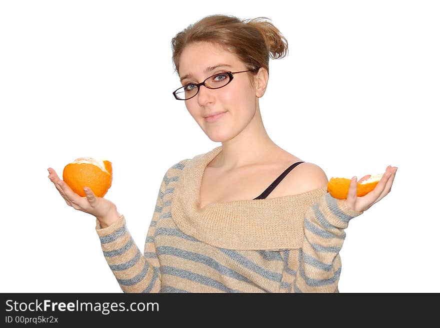 Beautiful young girl with orange isolated over a white background