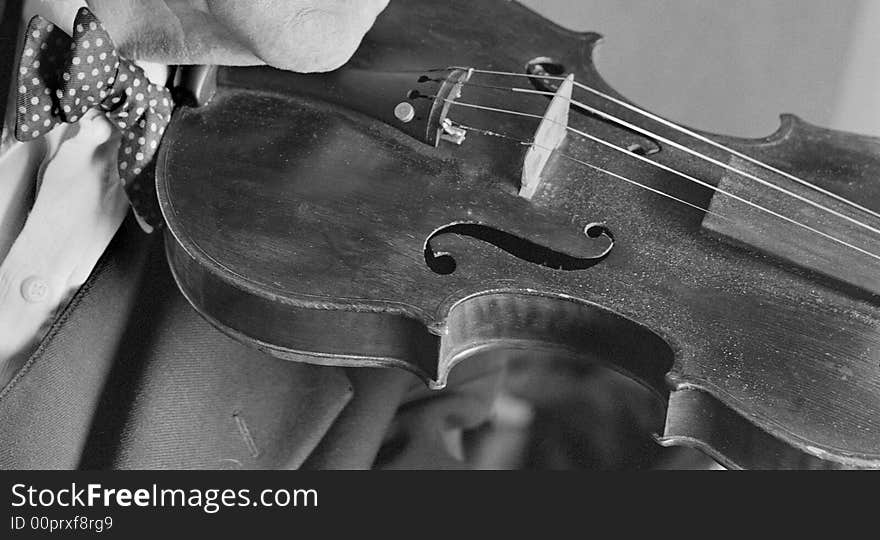 A musician with an old violin. A musician with an old violin.