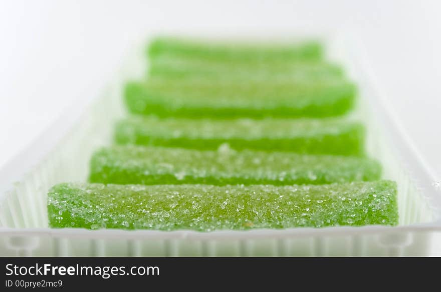 Green candies in white box