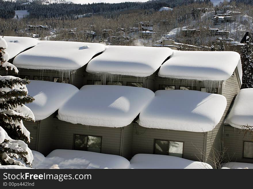 The roof covered with pile of snow. The roof covered with pile of snow