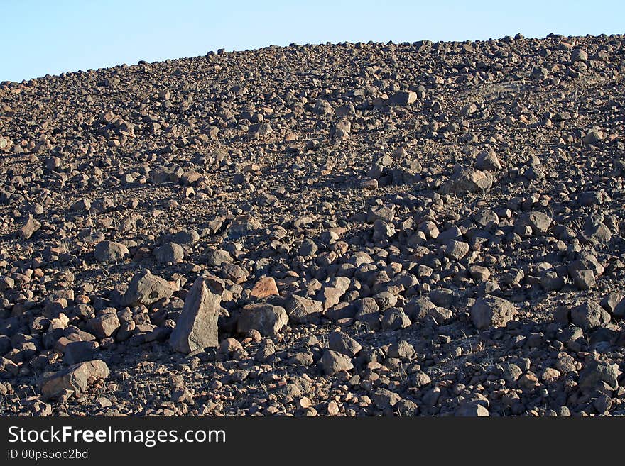 Looking up at a hill of rocky dry desert. Looking up at a hill of rocky dry desert