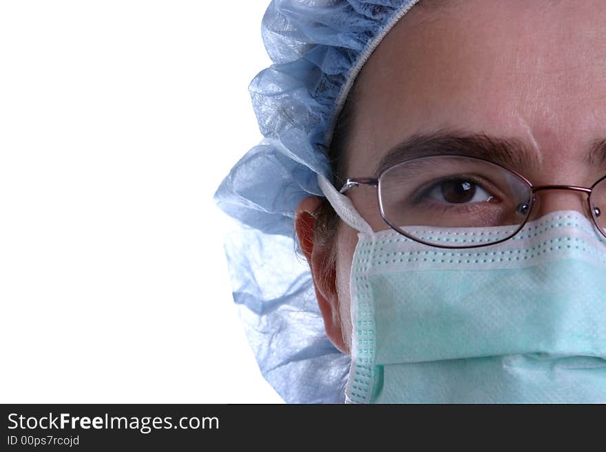 A closeup of a nurse or surgeon wearing a surgical mask on white background.