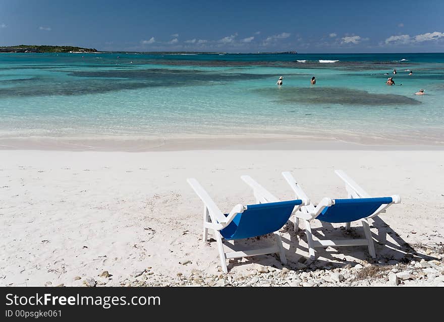 Canvas chairs on a beautiful caribbean beach. Canvas chairs on a beautiful caribbean beach