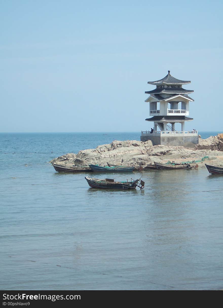 Boat and Building on the Sea near the beach