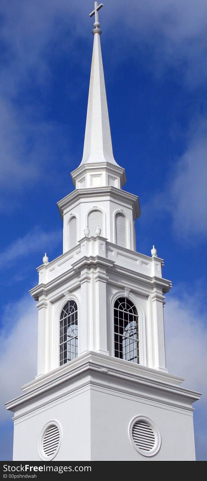 Elaborate church steeple on a sunny afternoon.