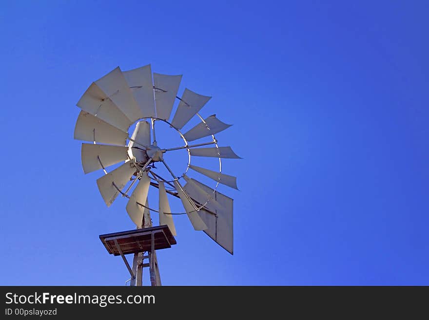 Farm wind mill blue sky