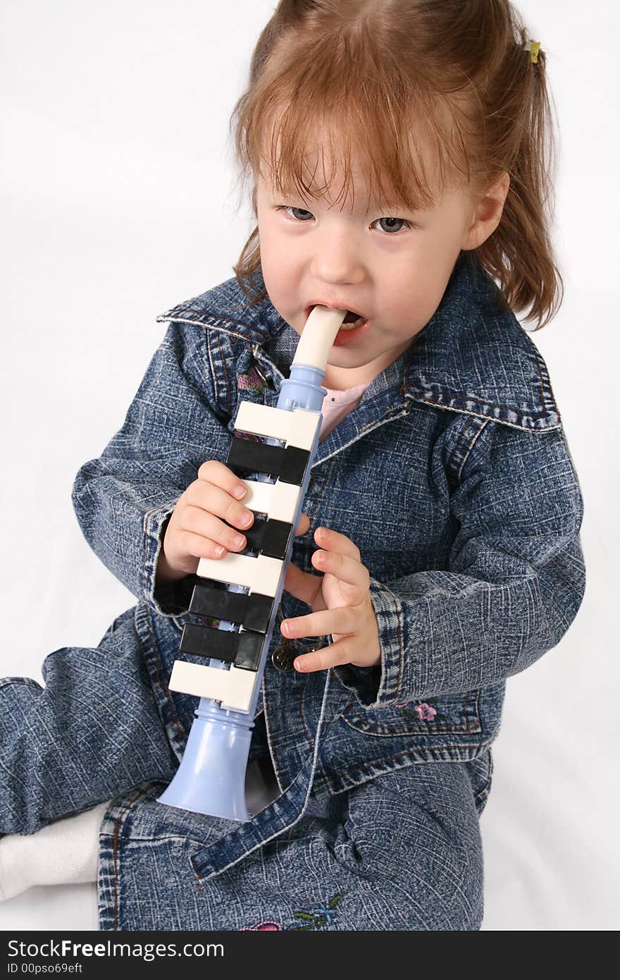 Girl plays on the pipe