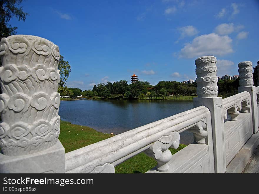 Stone brige, lake and pagoda in the park