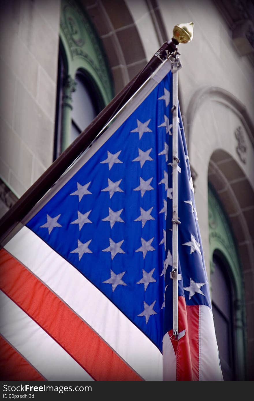 US flag against old building