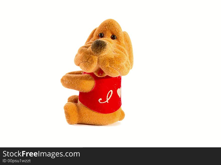 Isolated toy - sitting dog. It can holding something in its hands. Isolated toy - sitting dog. It can holding something in its hands.