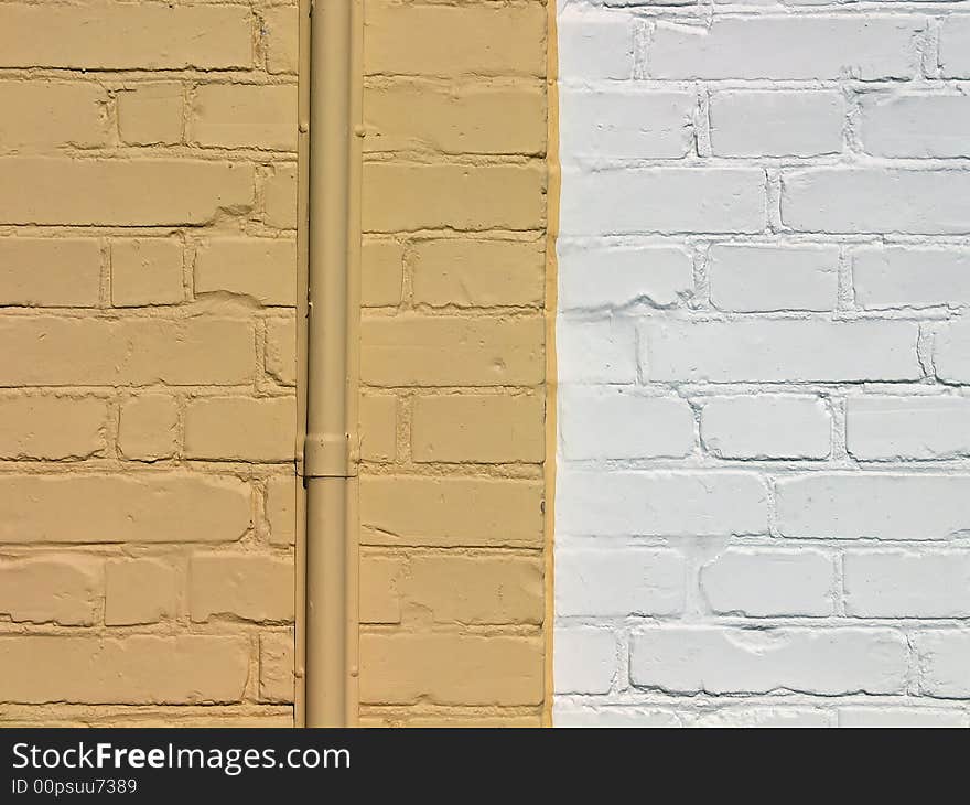 Wall made of painted yellow and white bricks. Wall made of painted yellow and white bricks