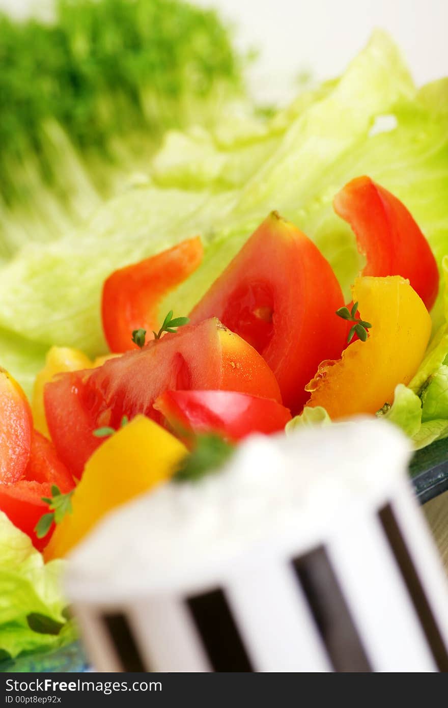 Resh salad with tomatoes and pepper behind cream cheese. Resh salad with tomatoes and pepper behind cream cheese