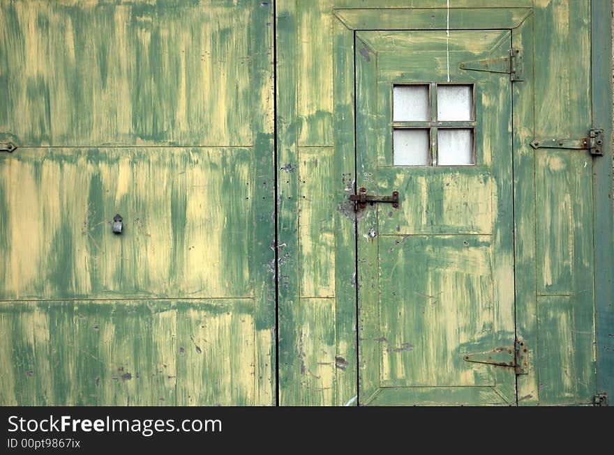 Grunge green and yellow industrial door door. Grunge green and yellow industrial door door.