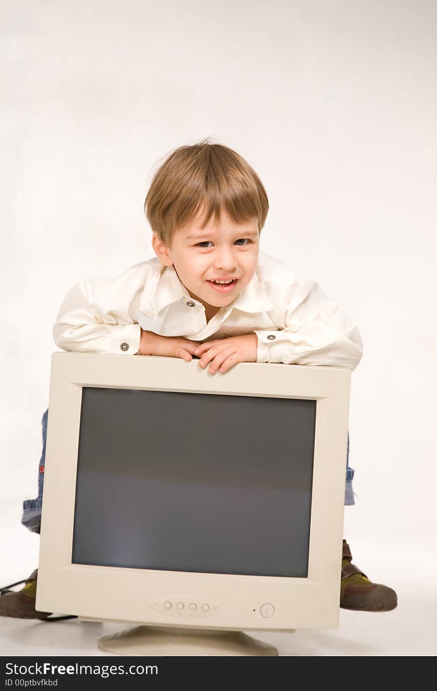 Little boy with computer monitor over white. Little boy with computer monitor over white