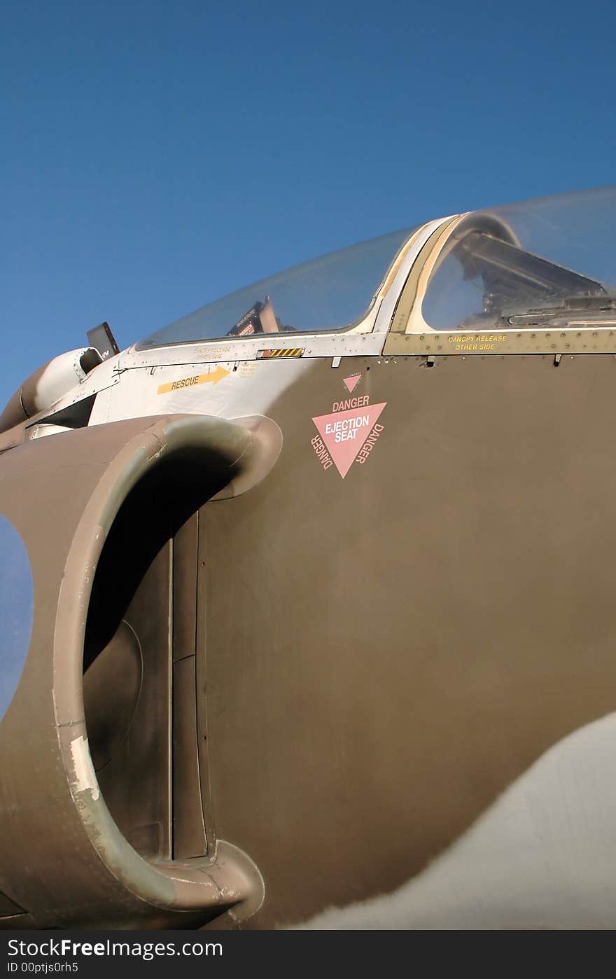 Engine and canopy of a vintage vertical take-off jet fighter. Engine and canopy of a vintage vertical take-off jet fighter