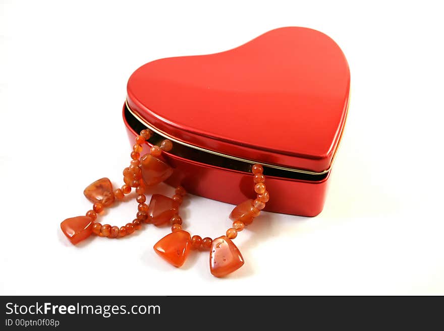 Cornelian necklace in red heart-shaped box as a  St Valentine Day's gift. Cornelian necklace in red heart-shaped box as a  St Valentine Day's gift