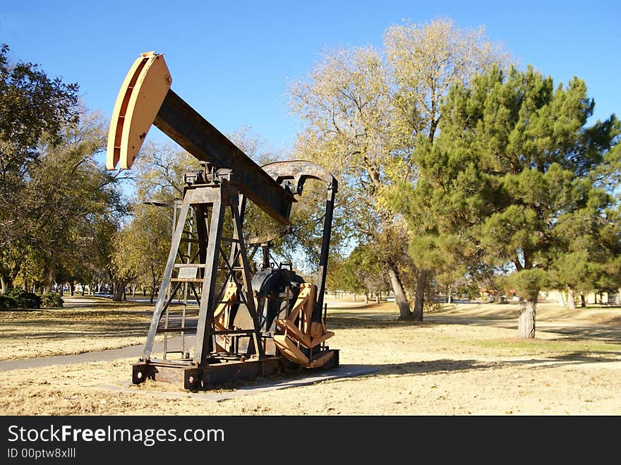 Retired oil pump jack in a park