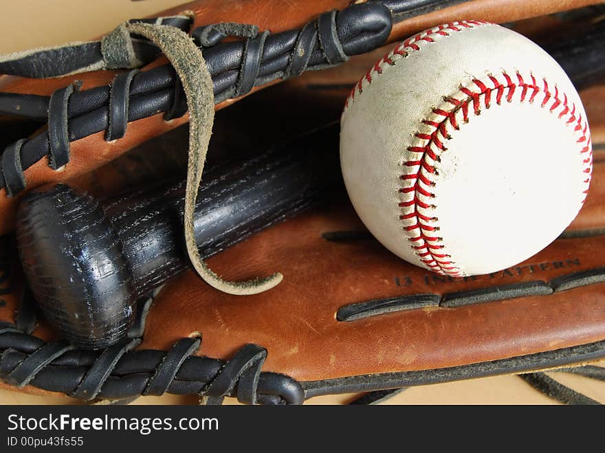 Bat ball and glove in natural light. Bat ball and glove in natural light