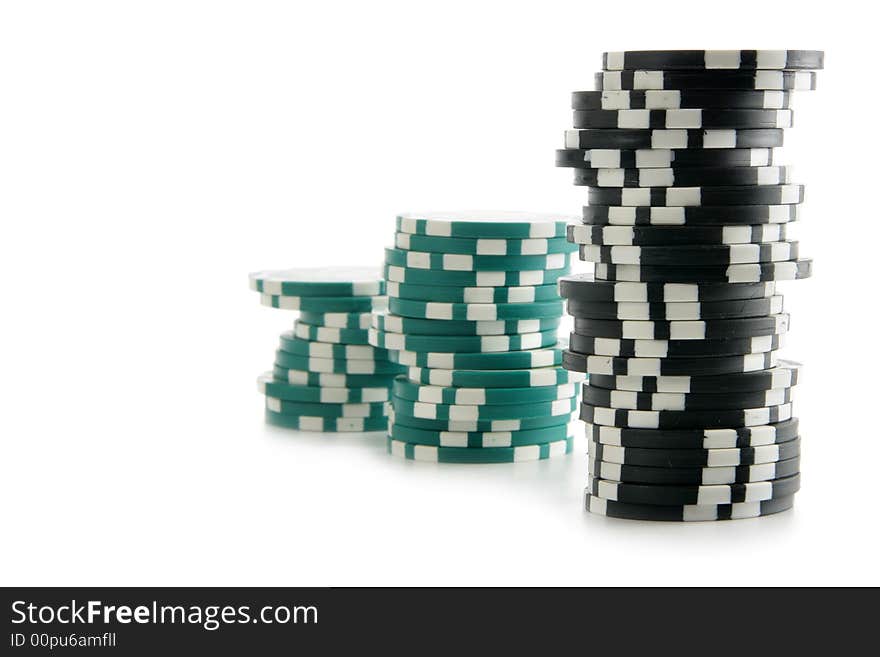 Stacks of gambling chips isolated over white background