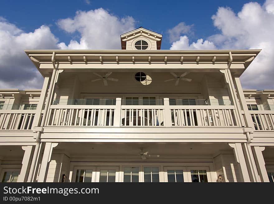 Beach Front Accommodations on a sunny day with cloudy blue skies. Beach Front Accommodations on a sunny day with cloudy blue skies