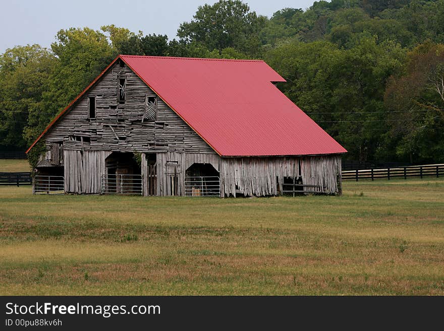 A rurL Frm in CentraL Tennessee, shows its age but keepson working. A rurL Frm in CentraL Tennessee, shows its age but keepson working