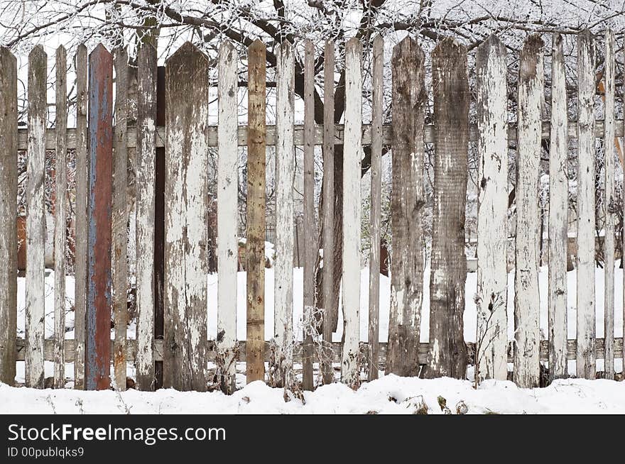 Wooden fence at winter