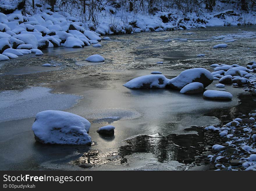 A river after the first winter snowfall near Cleveland Ohio. A river after the first winter snowfall near Cleveland Ohio.