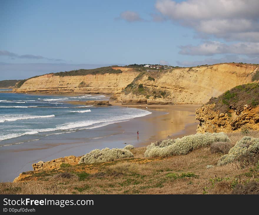 The Sandy beach surronded by cliffs in australia. The Sandy beach surronded by cliffs in australia