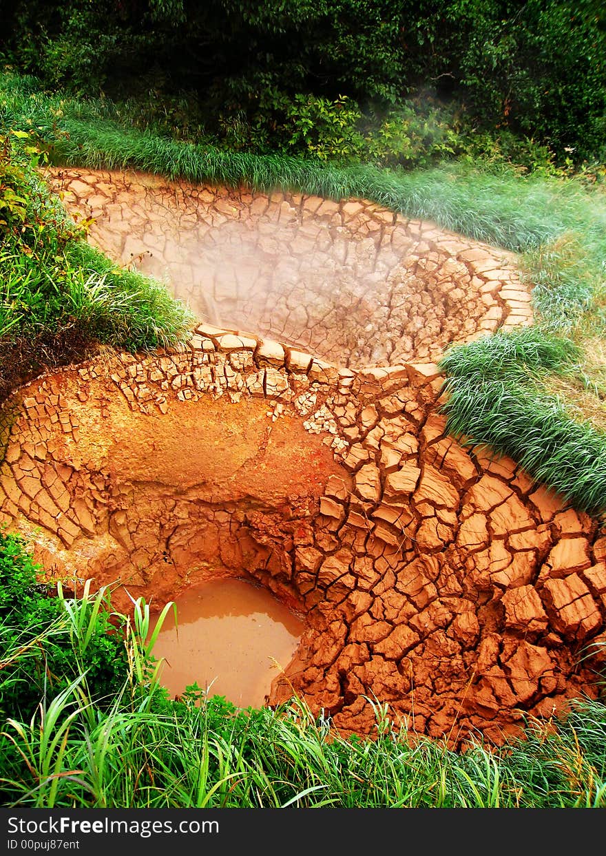 Valley of Geysers, hot mud sources, red clay and ground, national park. Valley of Geysers, hot mud sources, red clay and ground, national park