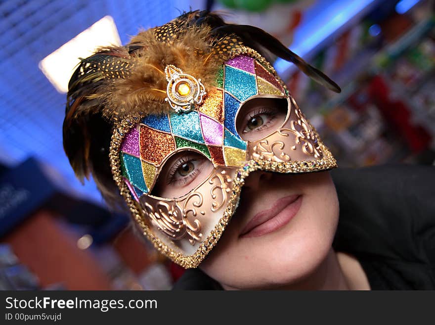 The green-eyed woman in the carnival mask. The green-eyed woman in the carnival mask