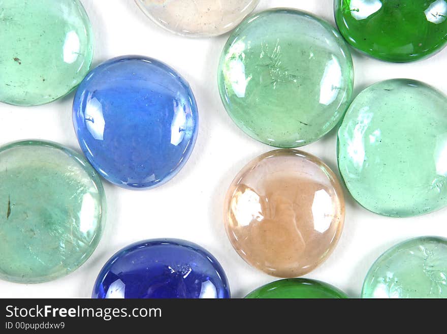 Colored glass stone isolated on a white background. Colored glass stone isolated on a white background.