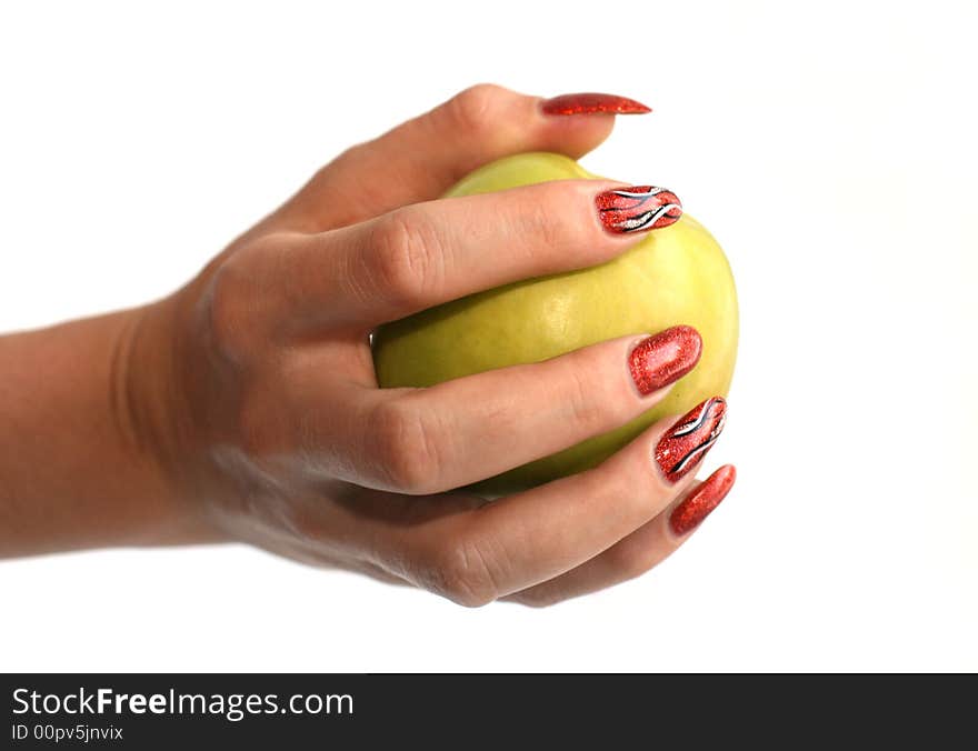 Female fingers with manicure hold an apple