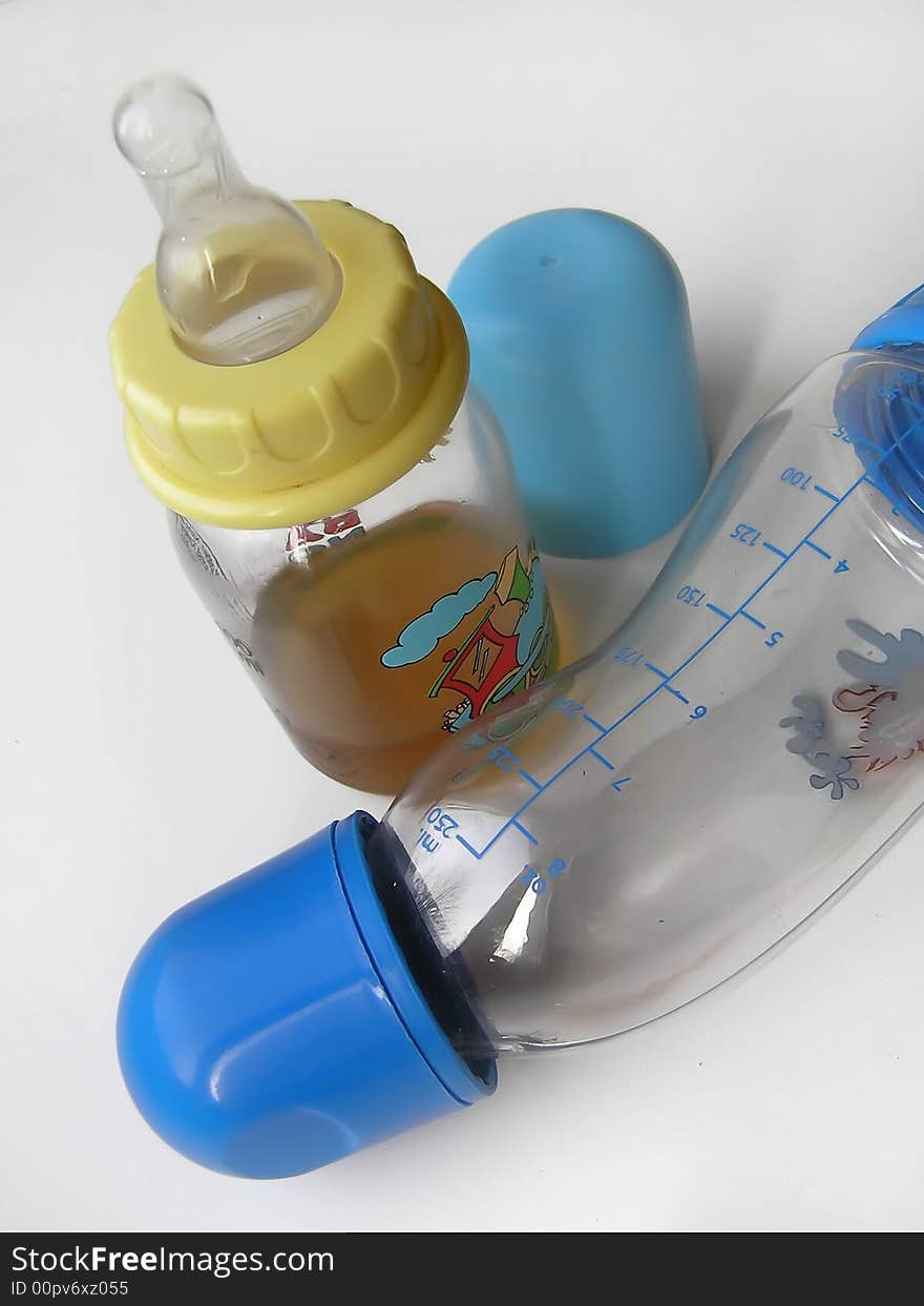 Children's bottles. One - empty the second with tea.