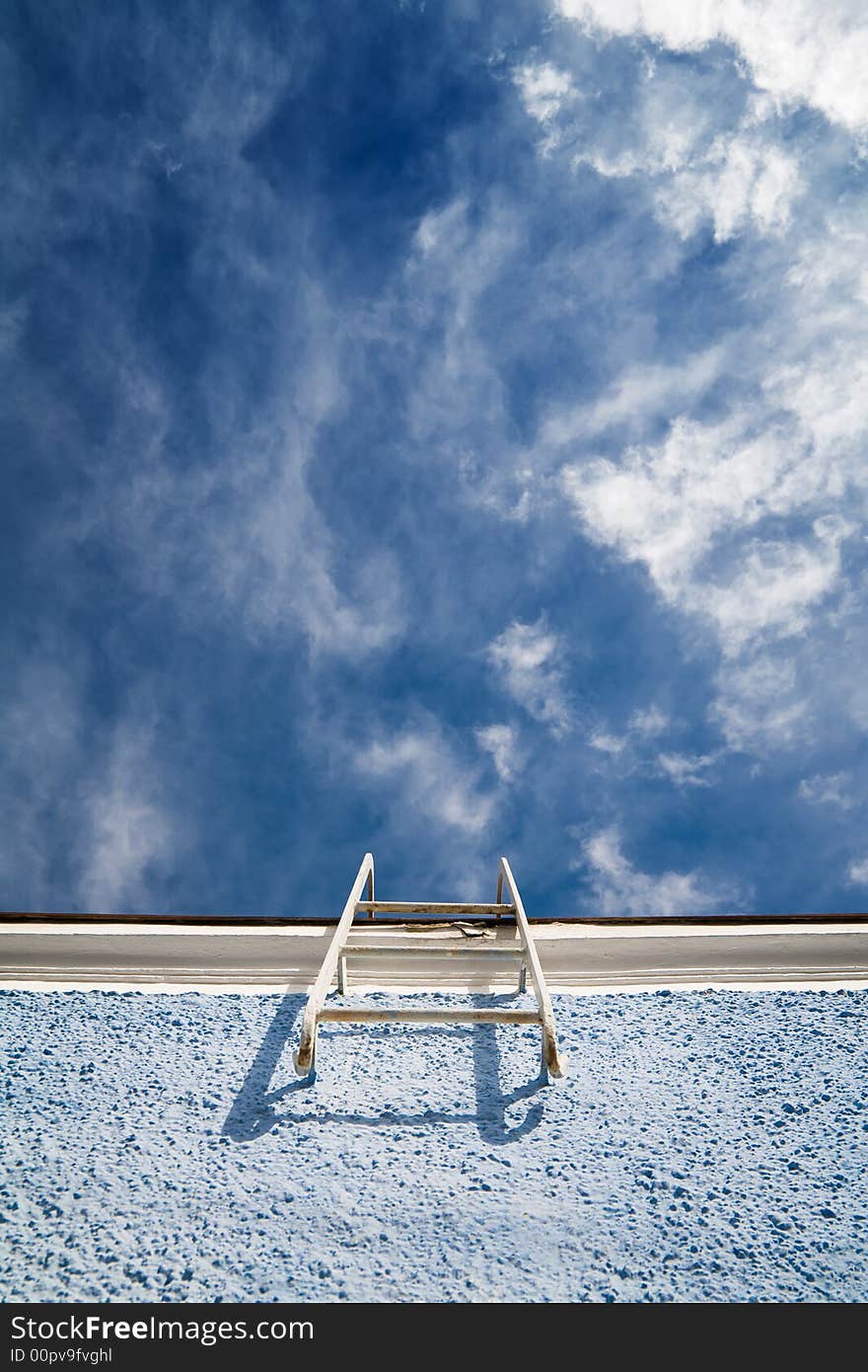 A maintenance ladder mounted to the wall of a building. A maintenance ladder mounted to the wall of a building.