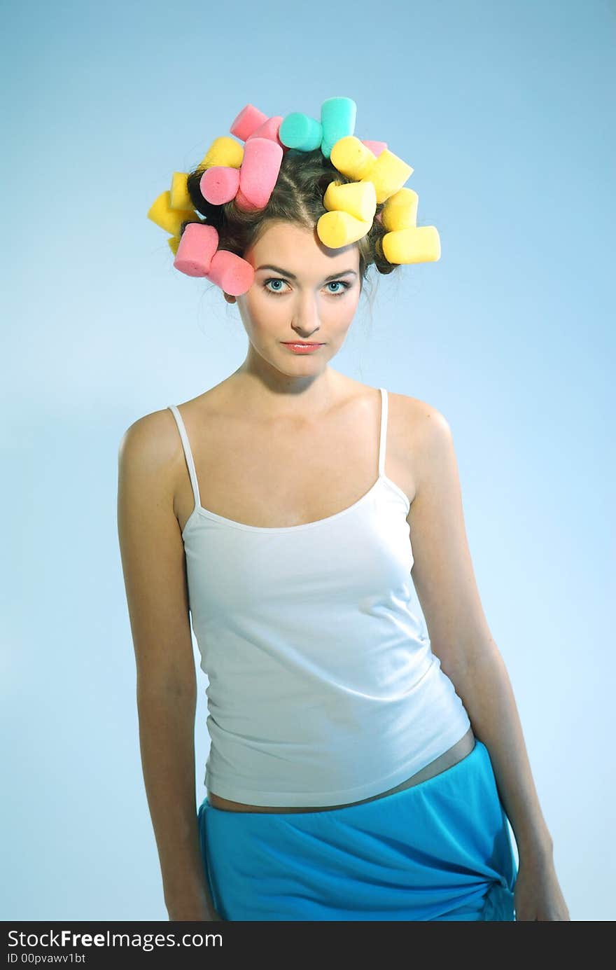 A woman in hair curlers