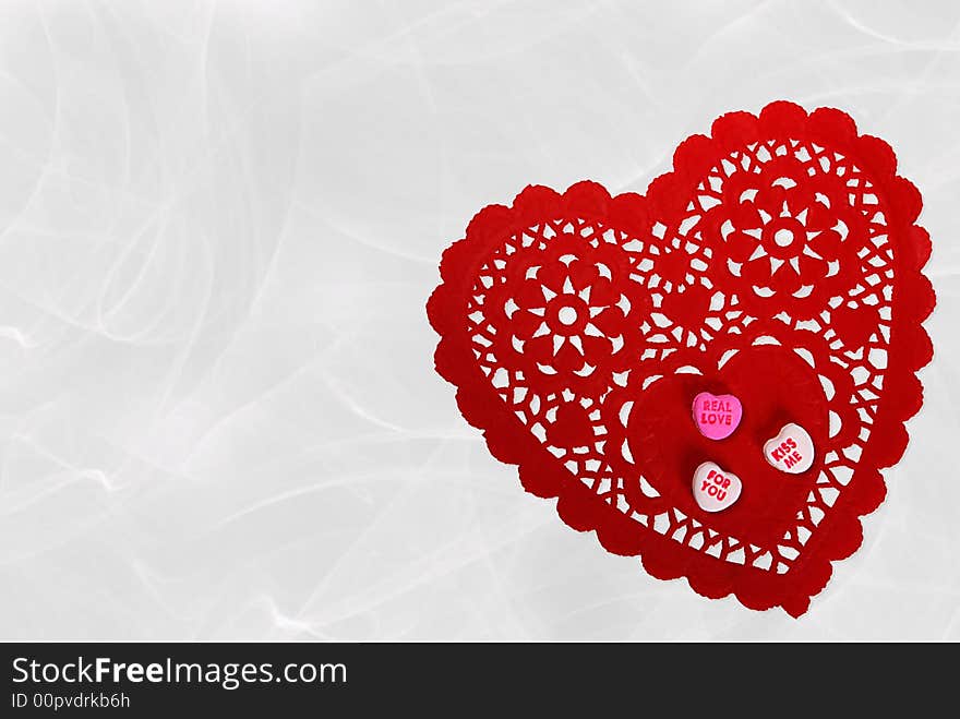 Valentine candy hearts on red lace doily. Valentine candy hearts on red lace doily.