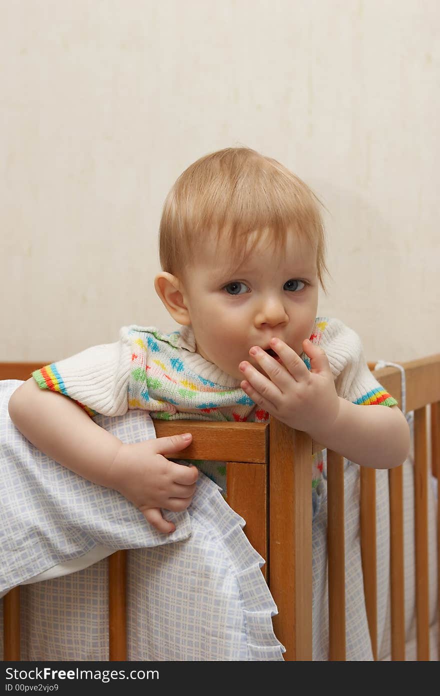 One-year old boy in a bed