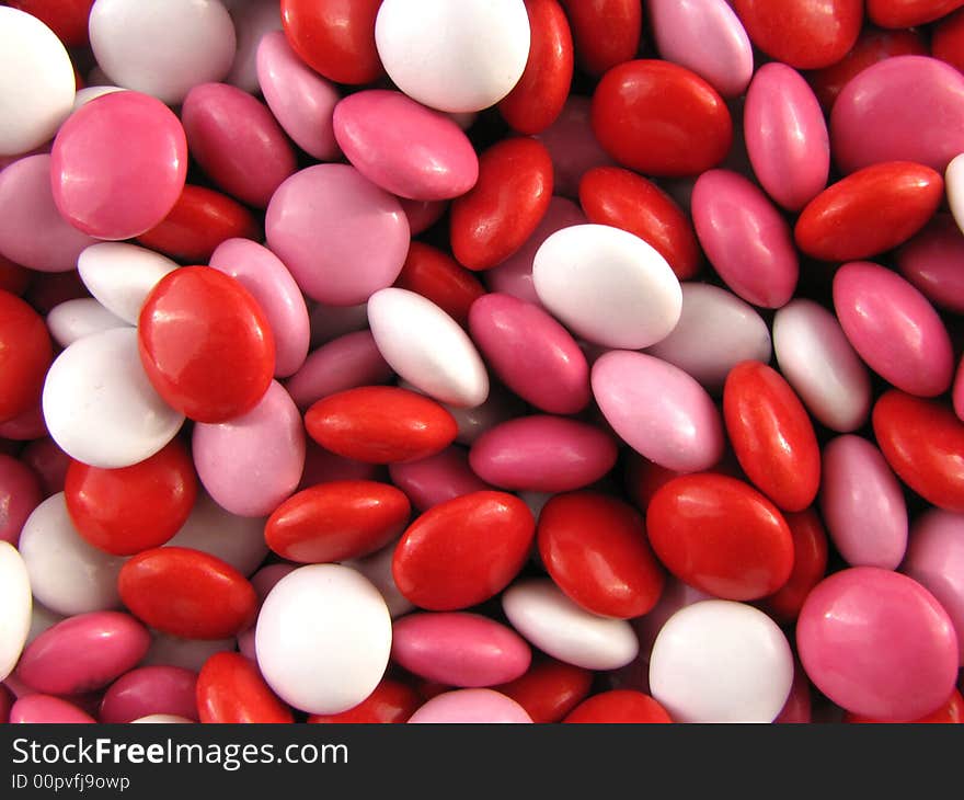 Macro of chocolate candies bright red and pinks. Macro of chocolate candies bright red and pinks