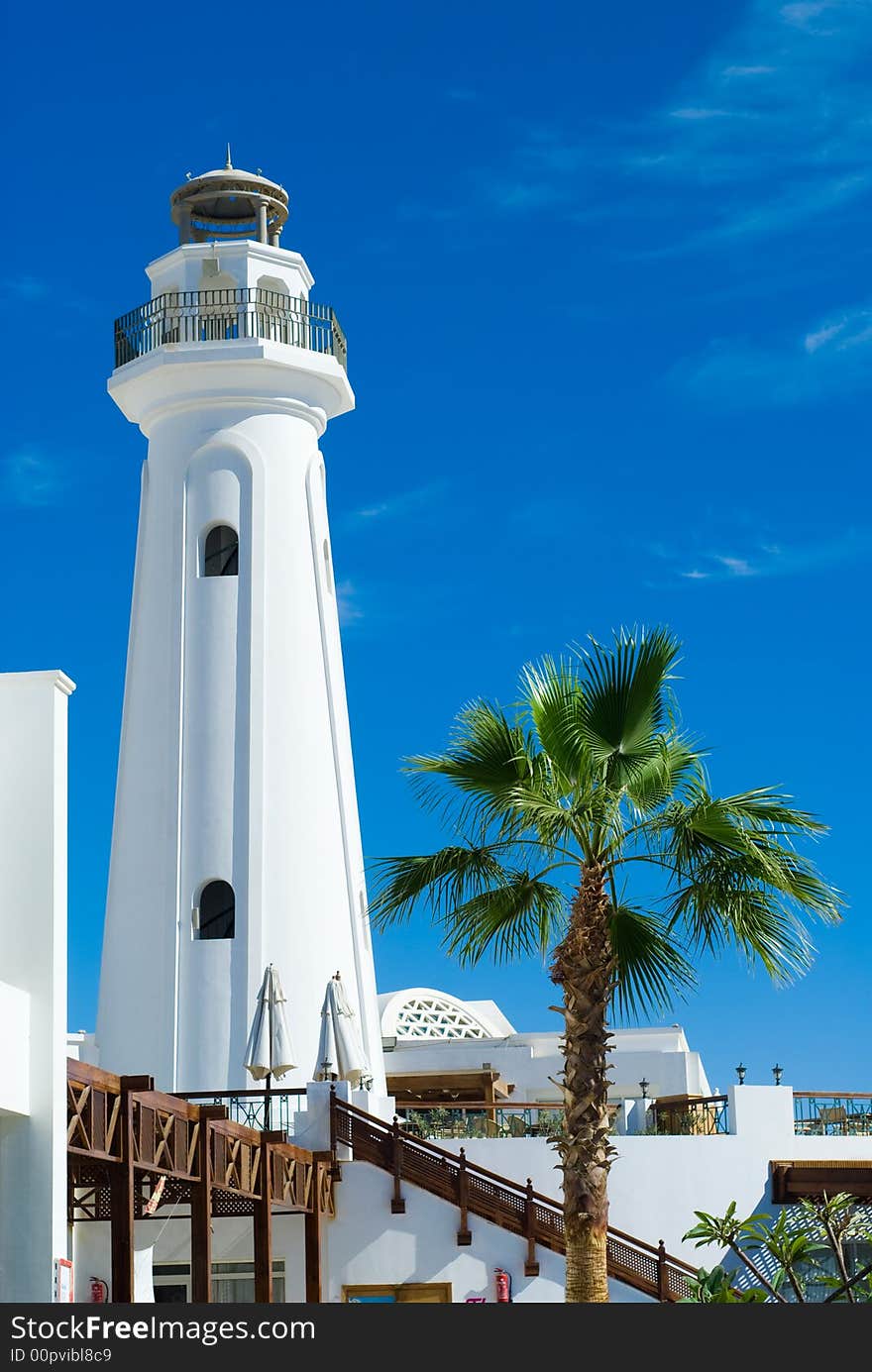 Lighthouse and palmtree