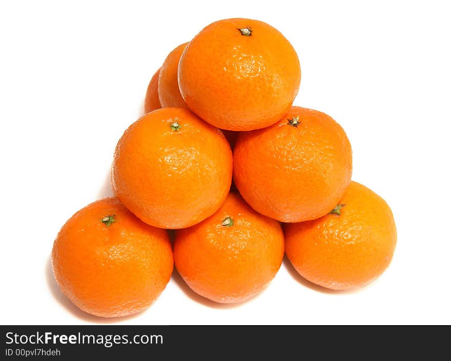 Pyramid from tasty ripe tangerines on a white background. Pyramid from tasty ripe tangerines on a white background.