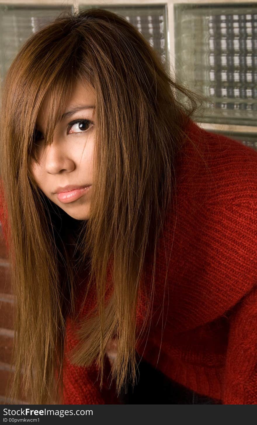 Fashion shot of female model showcasing how messy hair can still look good. Fashion shot of female model showcasing how messy hair can still look good.