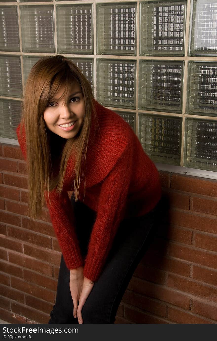 Fashion shot of female model showcasing her clothing and hair. Fashion shot of female model showcasing her clothing and hair.